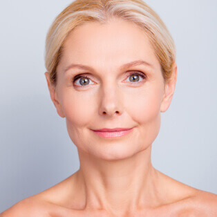 Young woman with hands on either side of her face